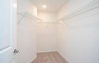 ***Photo from another townhouse recently completed in community with same finishes***

Owner's Walk-In Closet