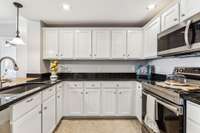 Spacious updated kitchen with plenty of counter space and ample storage.