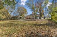 View of your spacious backyard with mature trees.  940 Willow Way Mcminville TN 37110
