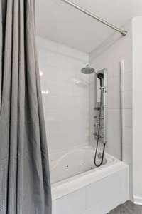 Shower/ tub combo in primary bathroom.  940 Willow Way Mcminville TN 37110