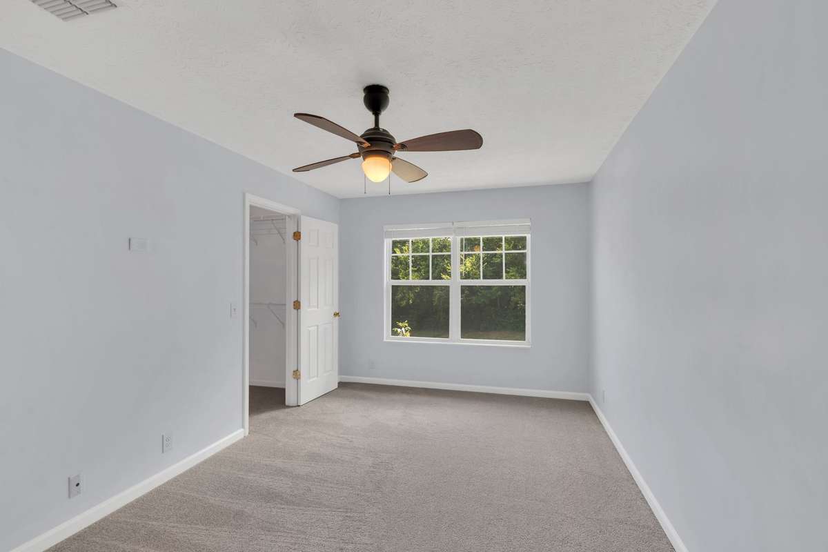 Bedroom with soft carpeted flooring!
