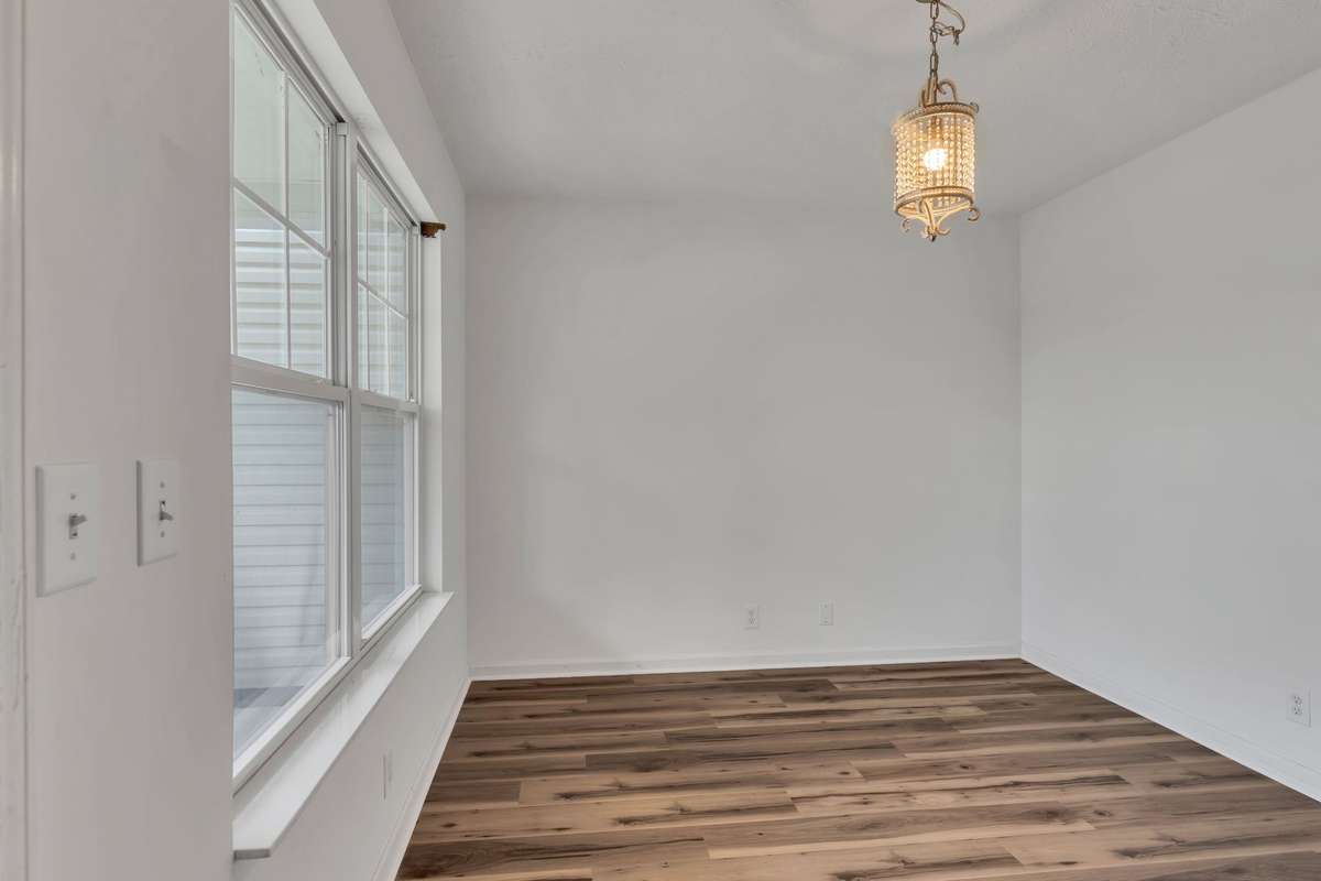 Dining Room with new flooring and awesome lighting!