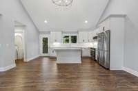 Gleaming hardwood floors and vaulted ceiling surround this entertaining kitchen.(pic from prior listing)