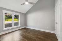 Second bedroom on main level. Vaulted ceilings, hardwood floors, and natural light. (pic from prior listing)