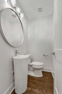 Half bathroom downstairs. (pic from prior listing)