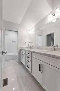 Beautiful updated bathroom with double vanities. (pic from prior listing)