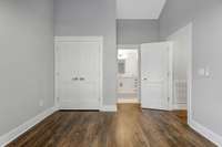 View of bedroom with another angle of closet, vaulted ceiling and bathroom. (pic from prior listing)