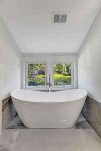 Large soaking tub in private bathroom. (pic from prior listing)