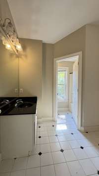 Separate from vanity area is a combo tub/shower.