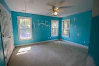 Bedroom 6 upstairs complete with lots of light, nice size closet, ceiling fan and windows overlooking the beautiful back yard.
