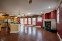 Super large kitchen with a cozy gas fireplace. Double oven, smooth stove top, microwave, dishwasher. Walk in pantry. Doors to deck. Lots of light.