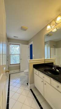 Full bath with combo shower/tub off of hallway and 3rd bedroom.