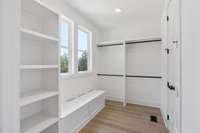 Now that's a closet!  Even built-in storage/bench