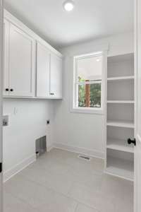 So convenient and functional!  The owner's closet connects to the first floor laundry!