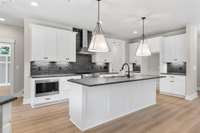 All the appliances are stainless, the lighting is stellar and the black finish fixtures are a hit!