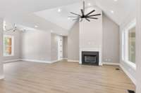 Open Floor plan with a wood burning fireplace.