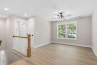 On the second level, you will find a second gathering spot with a view of the backyard.