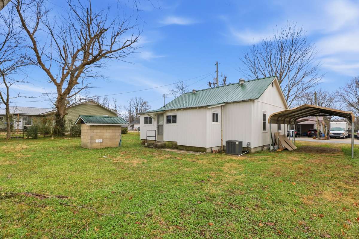 This home comes with a large yard and carport