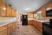 Kitchen with custom made wood cabinets and trim