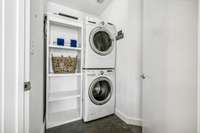 Enjoy the washer and dryer conveniently situated near the kitchen for easy access.