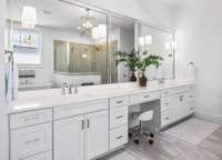 Reminsent of a spa, this room is only rivaled by its oversized primary closet custom designed by California Closets.