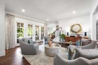 Tall ceilings and banks of French doors lead to an incredible addition.