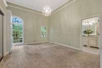 Primary Bedroom and Door to Bath