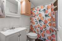 Full bath with combo tub/shower and plenty of storage.