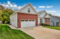 Sidewalk & side access door added to the garage area. The garage also includes a wash sink!