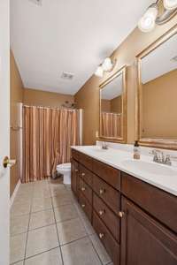 One of two full baths upstairs featuring a convenient tub shower combo.