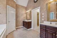 Double vanities provide function and style in the primary suite bath.