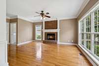 Perfect for entertaining—gathering room with fireplace just off the kitchen.