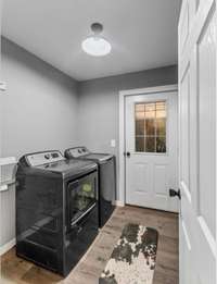 Separate laundry room w/ washer and dryer