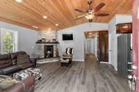 Large living room with beautiful vaulted pine wood ceilings