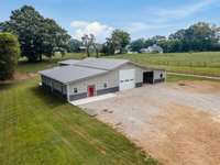 Just under 5 acres with 3 fenced pastures and a turn out pin