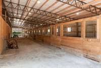 11 stall barn w/ extra storage for hay or equipment. Shop also has loft area for storage