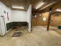 Concrete wash bay with shoeing/ grooming stalls