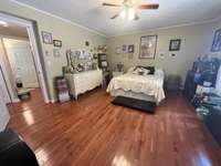 Primary bedroom with walk-in closet and en-suite bathroom.