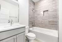 2nd full bathroom upstairs is conveniently located outside the largest bedroom/bonus room at the front of the home