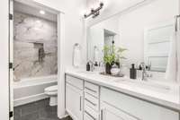 A shared bathroom for bedrooms 3 and 4 completes the upstairs