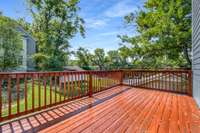 Step outside to enjoy the sun-soaked deck, perfect for grilling, entertaining, or relaxing