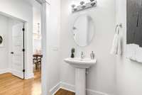 Main floor half bath, across from the home office