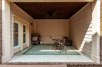 The private covered patio is located off the kitchen and dining room. Imagine having your morning coffee here!