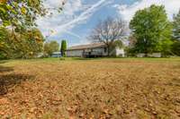 back of cleared back yard looking toward home