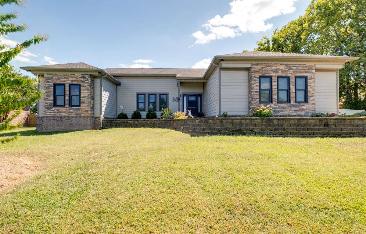 140 Spencer Springs - 3 bedroom 2 bath home with office and huge recreation room full of windows facing the almost one acre lot!