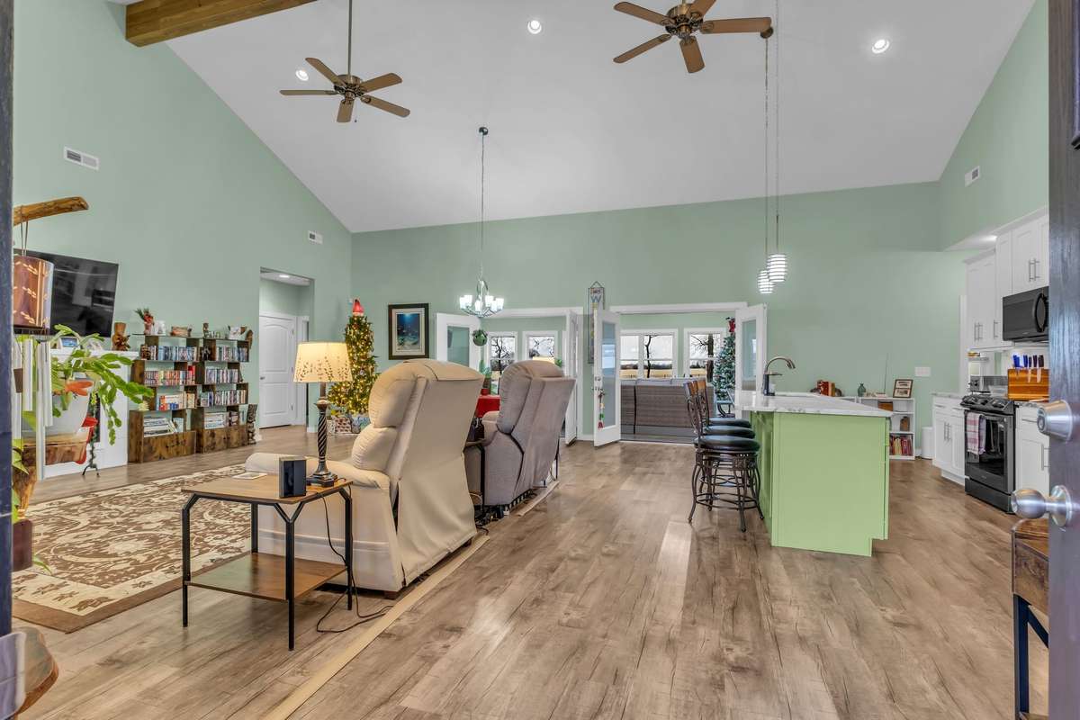 Enter this beautiful, updated home into the Great Room with soaring ceilings.