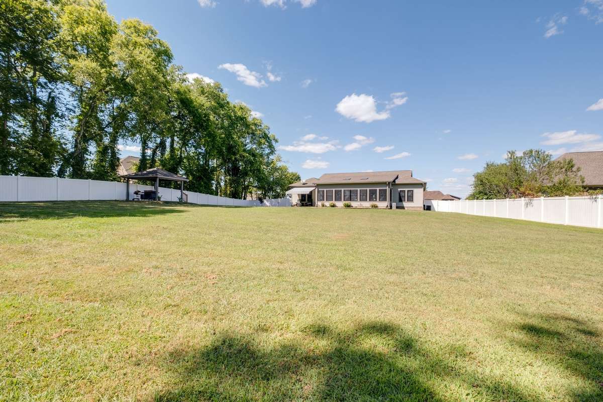 Plenty of room in this fully fenced backyard that backs to a family farm.
