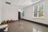 This room was used as a Billiards Room and is located off the garage.  The room is heated and cooled and would make a great home office or a Gym.