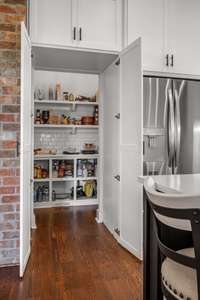 Wrap Around Hidden Pantry with Tiled Backsplash * These Builders Thought of Everything