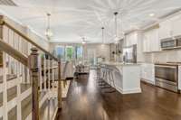 Kitchen, dining and living rooms open to each other. Great for entertaining!